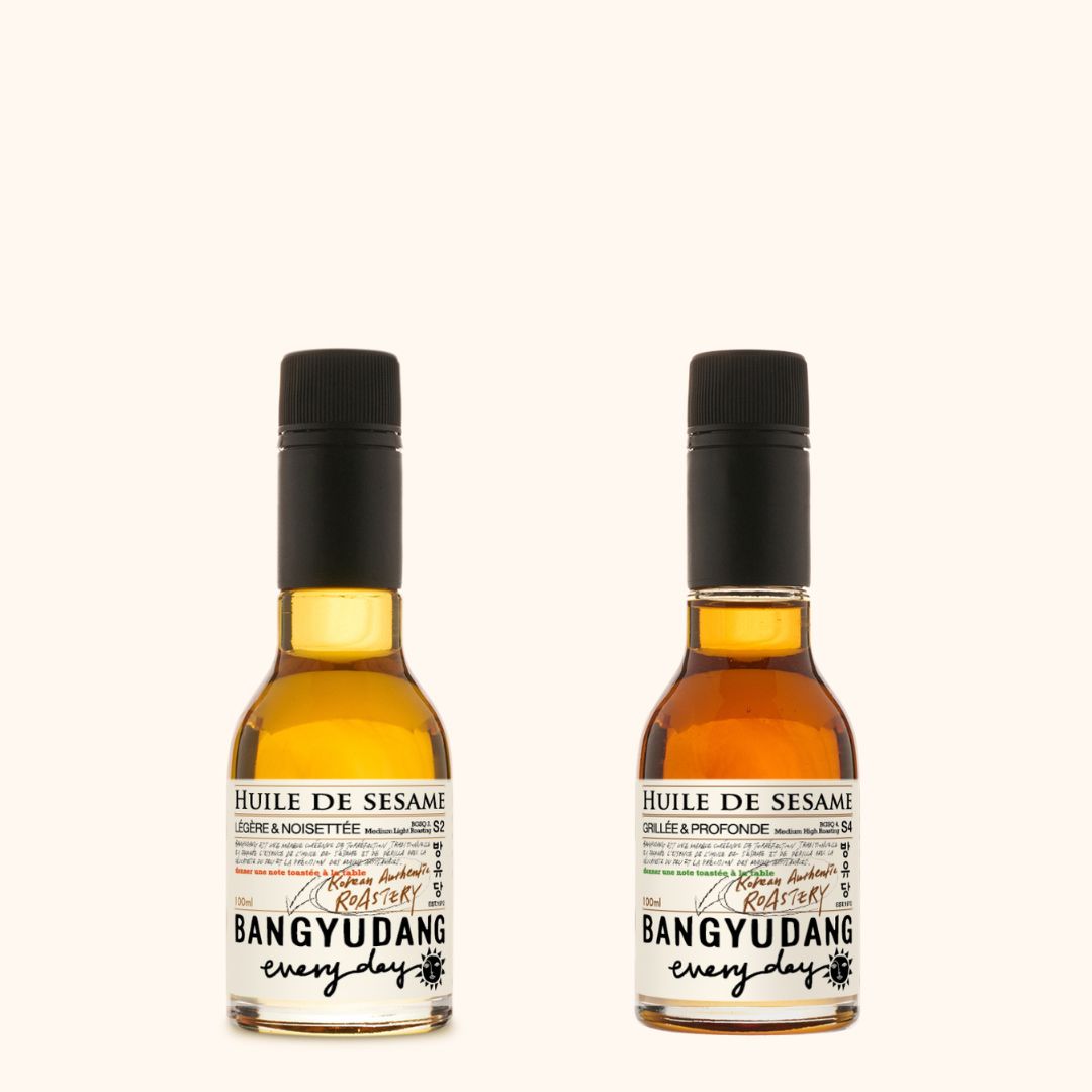 Duo découverte d'huiles de sésame coréennes de la marque Bangyudang. Deux jolies bouteille de 100ml, aux belles couleurs ambrées.