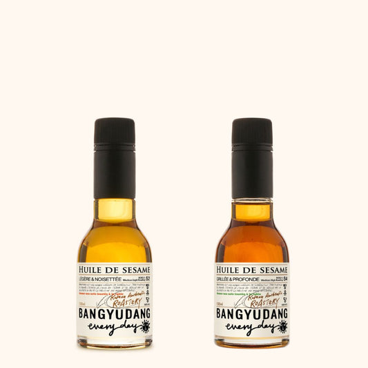 Duo découverte d'huiles de sésame coréennes de la marque Bangyudang. Deux jolies bouteille de 100ml, aux belles couleurs ambrées.