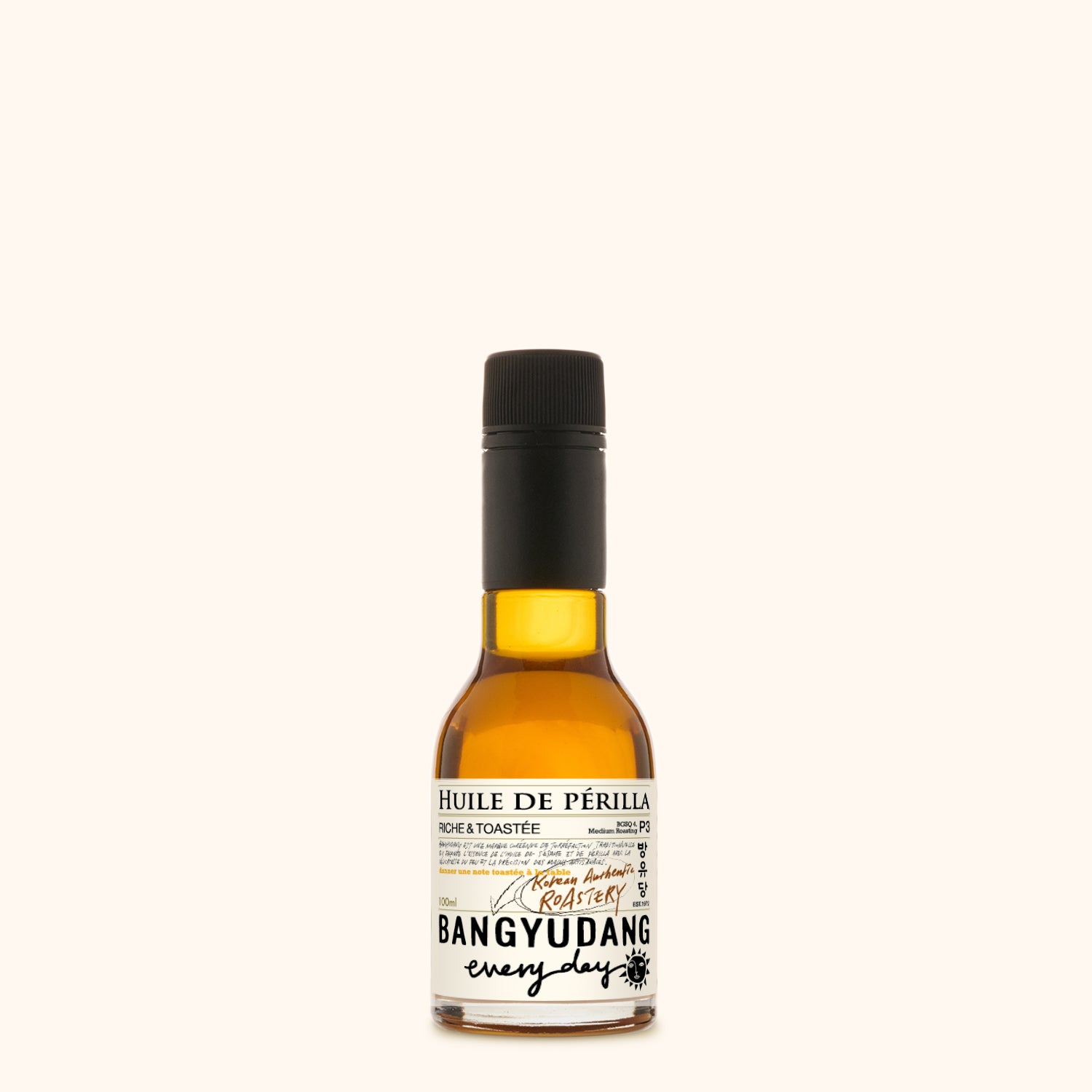 Bouteille de 100ml d'huile de périlla torréfiée Bangyudang P3, fond clair, étiquette beige à motif floral et typographie noire.
