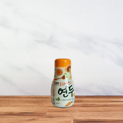 Bouteille de sauce Yondu 275 ml Sempio, étiquette végétale aux tons verts et orange avec illustrations de légumes.