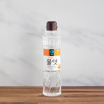 bouteille de sirop de mais translucide